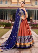 Tussar Silk Orange Traditional Wear Foil Printed Lehenga Choli